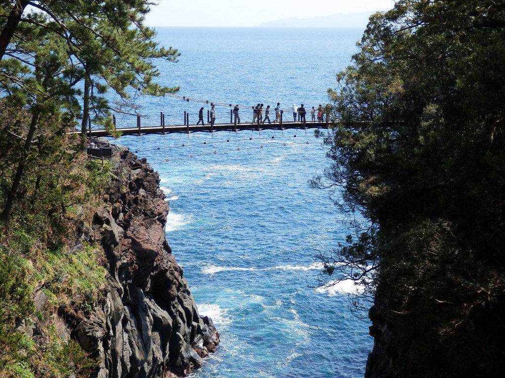 A suspension bridge over a rocky inlet on the Jogasaki Coast